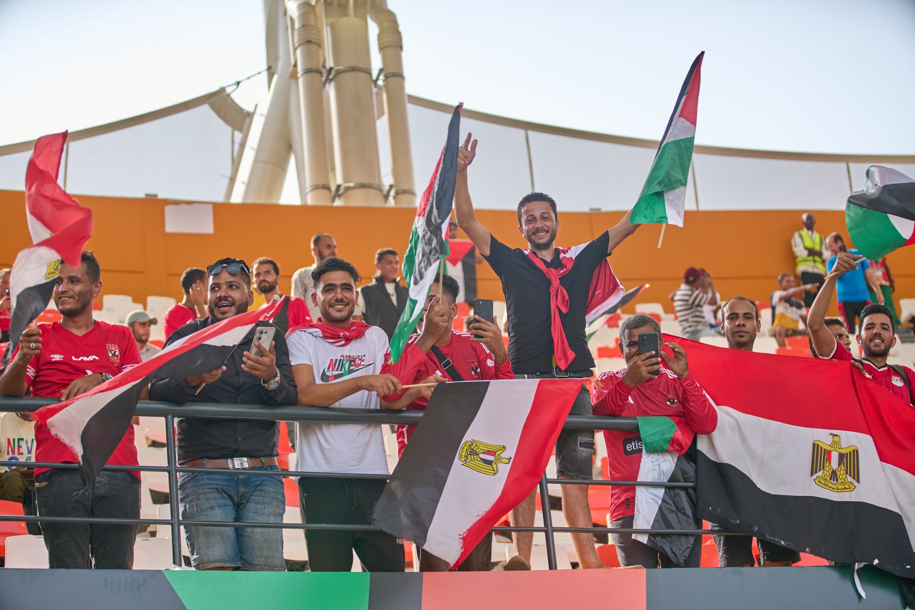 Football fans cheering at stadium